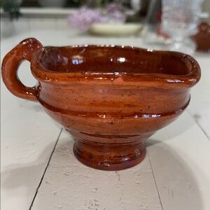 The object is a type of ceramic cooking pot called a cazuela earthenware Latin